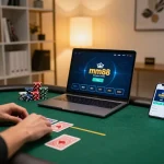 Person strategizing with mm88 poker game on laptop, showcasing a dynamic online gambling setup.